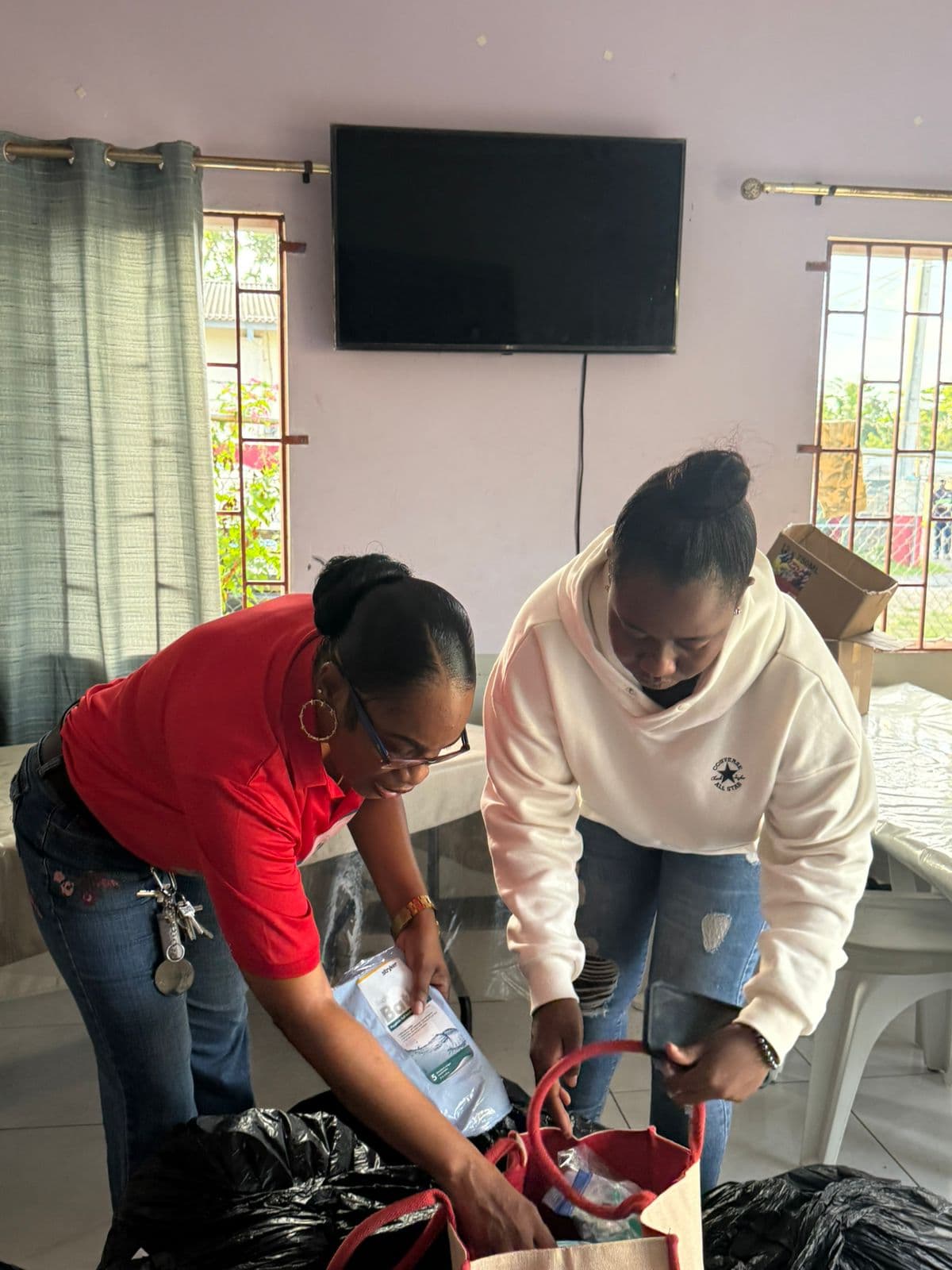 Volunteers packing bags for distribution